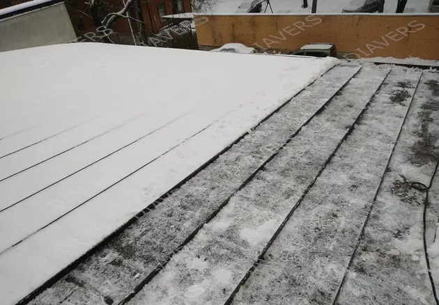 Dächer von Eis und Eiszapfen reinigen